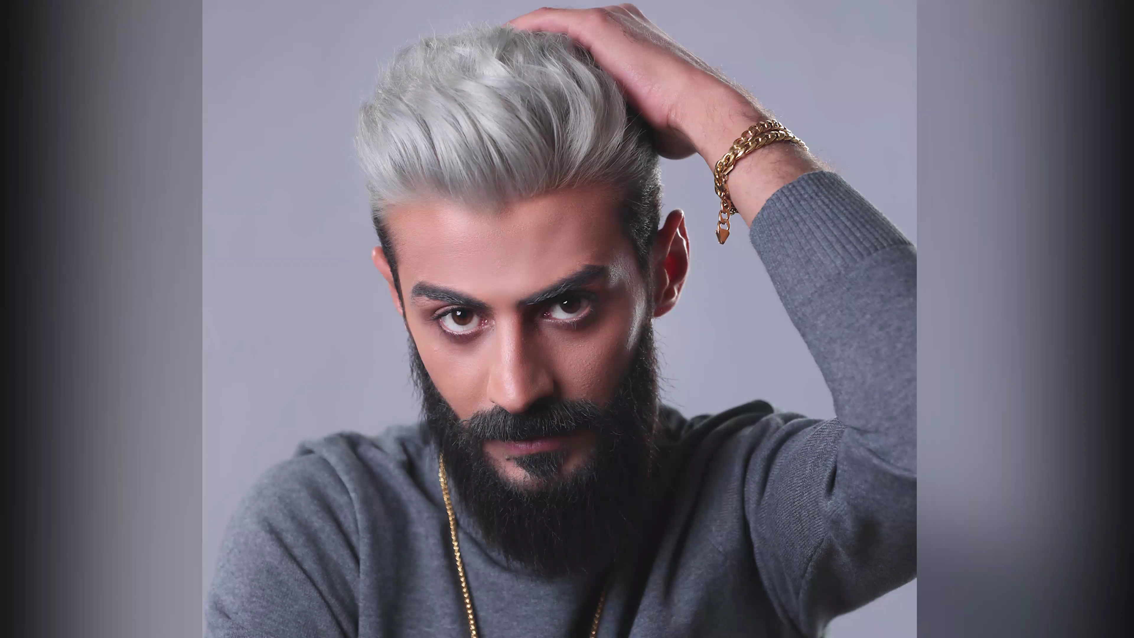Studio portrait showcasing a silver hair color transformation