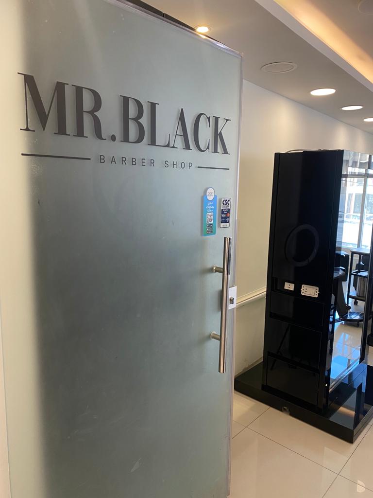 Mr. Black Barber Shop frosted glass entrance door inside Golden Gate Mall